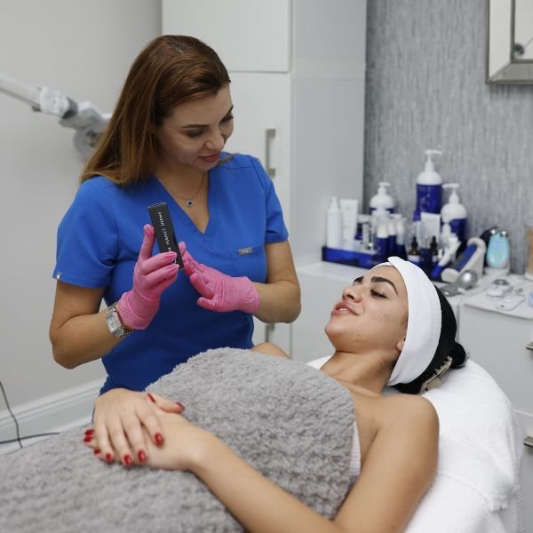 A beauty expert discussing treatment options with a client during a personalized consultation.