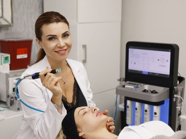 Irina from Beauty Power by Irina near Boca Raton is performing a laser skin rejuvenation treatment on a client